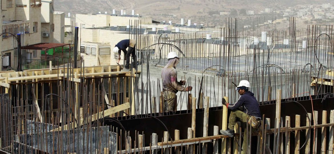 File photo of Palestinian labourers working on a construction site in Ramat Shlomo