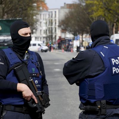 Belgium police officers secure the access during a police operation in Etterbeek
