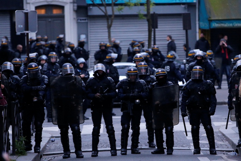 French CRS riot police face off with demonstrators after the announcement of results in the election of Emmanuel Macron as French President, in Paris