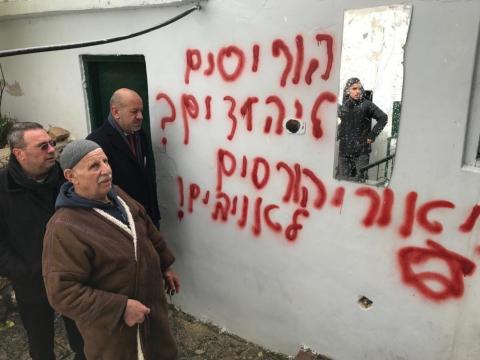 residents_of_shrafat_standing_beside_a_racist_graffiti_on_mosque_-_sondus_eweis_-_mee_0